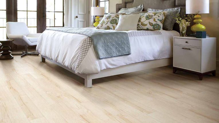 warm and bright wood look laminate flooring in a bedroom